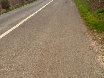 FRENTE A CAMINO PAVIMENTADO